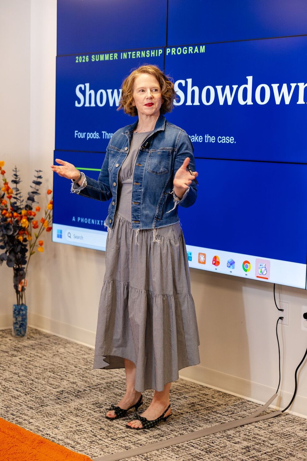 Tela Mathias opens Showcase Showdown in front of the title slide