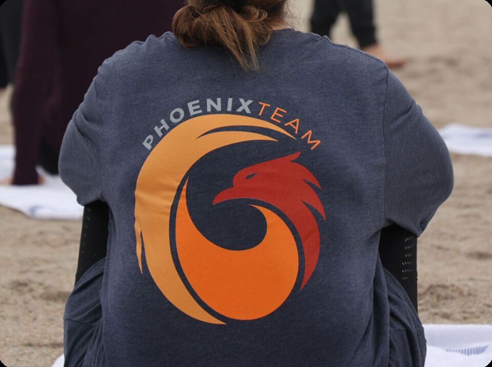 PhoenixTeam shirt at a team offsite on the beach
